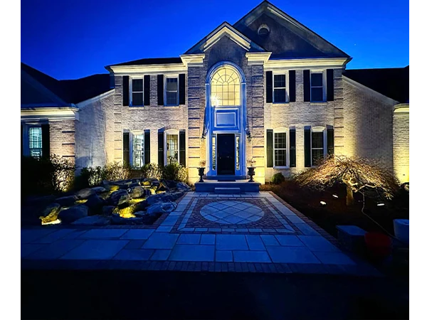 Home in Maryland with beautiful front yard landscape lighting