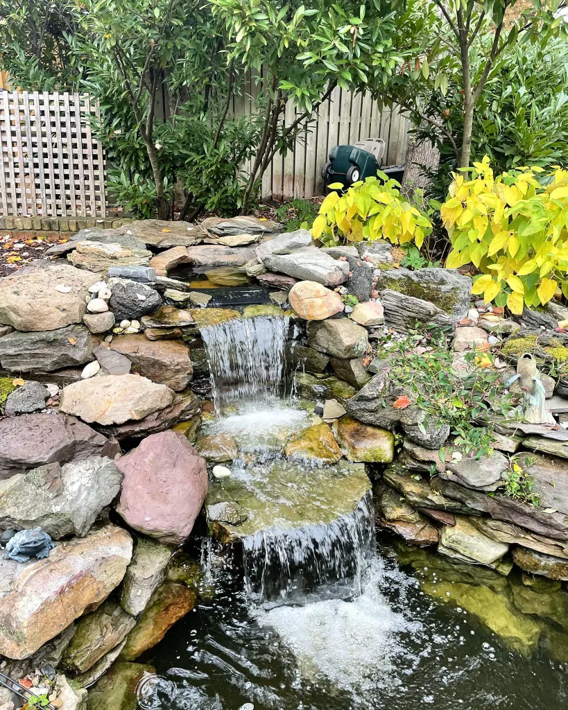 Small waterfall with water splashing and tumbling over the rocks